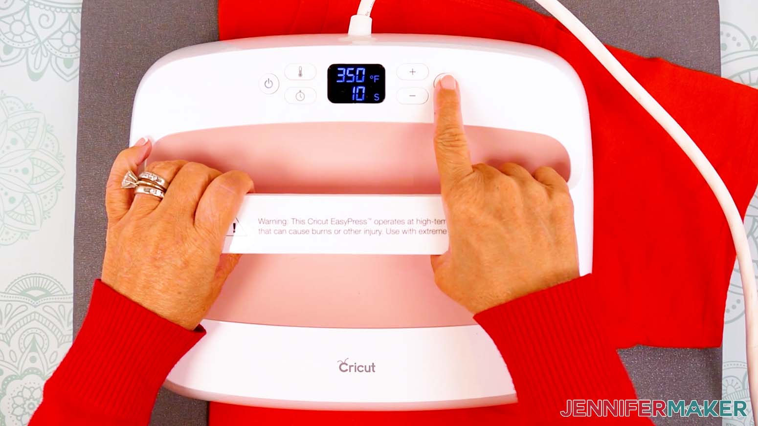 Press the center crease of the shirt to remove moisture and add an alignment crease before pressing the Cricut DTF onto the shirt.