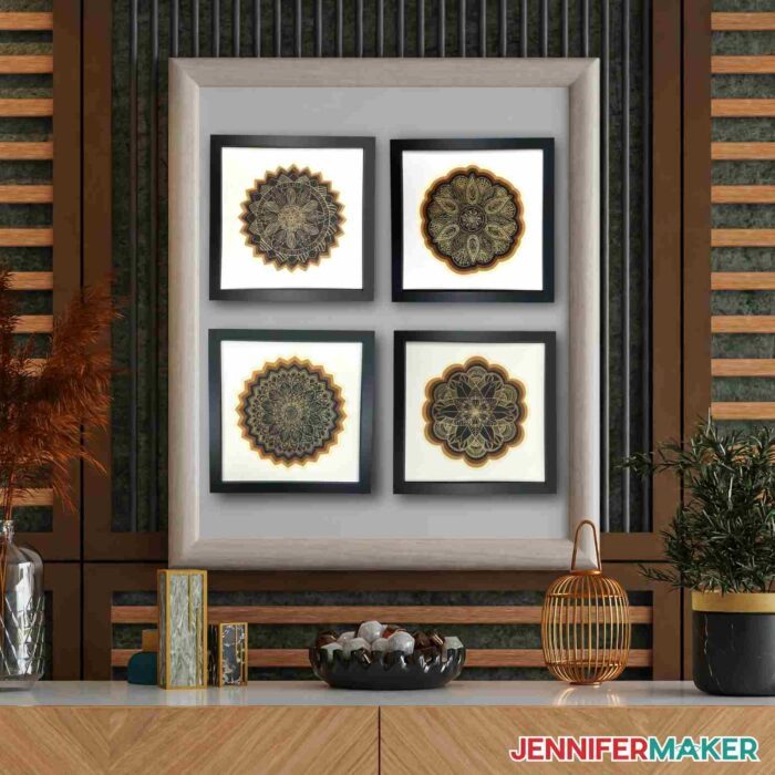 Four framed Cricut foil projects on display