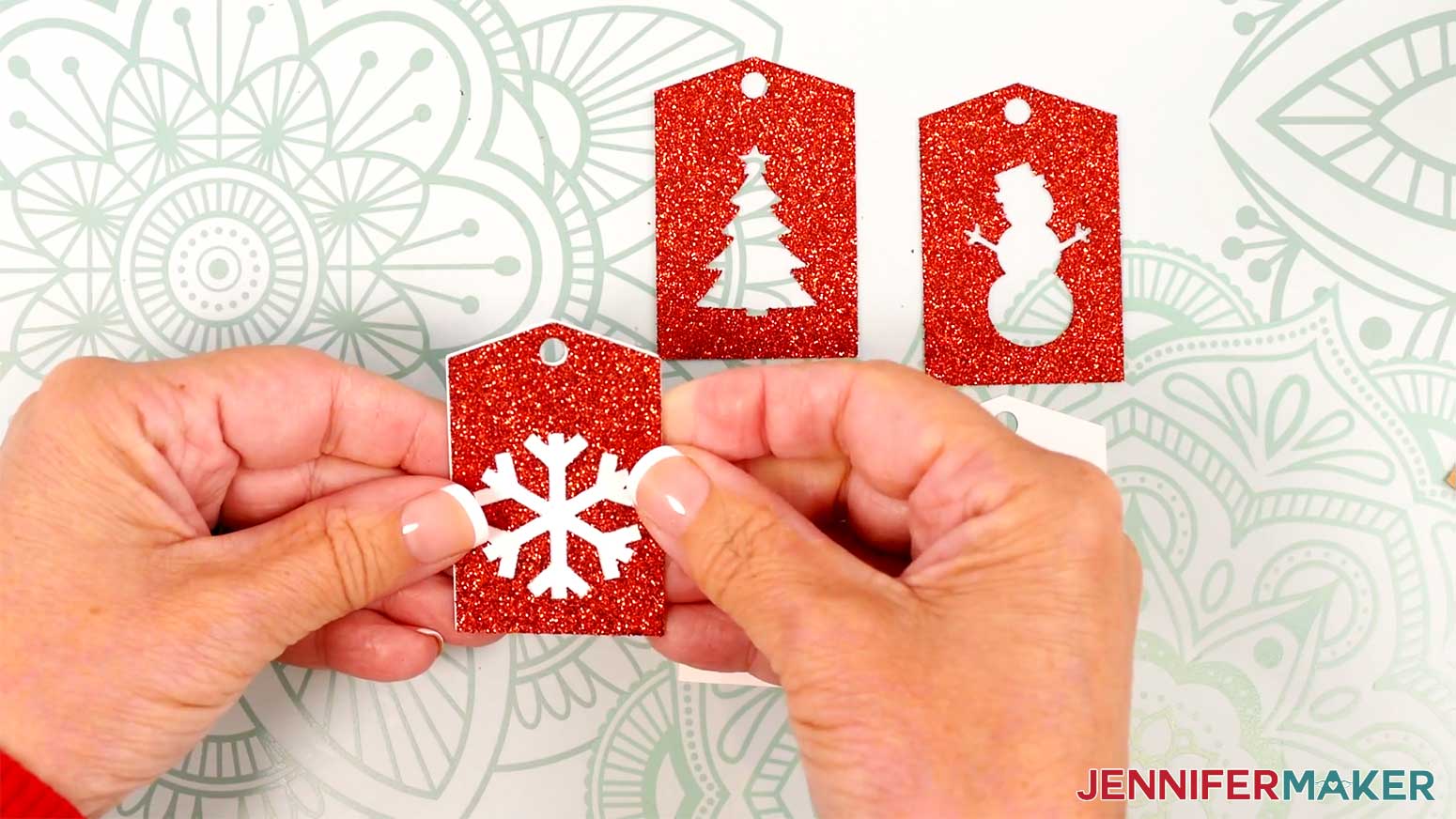 Adhere the glitter tag to a white tag in the Cricut Gift Wrapping Ideas project.