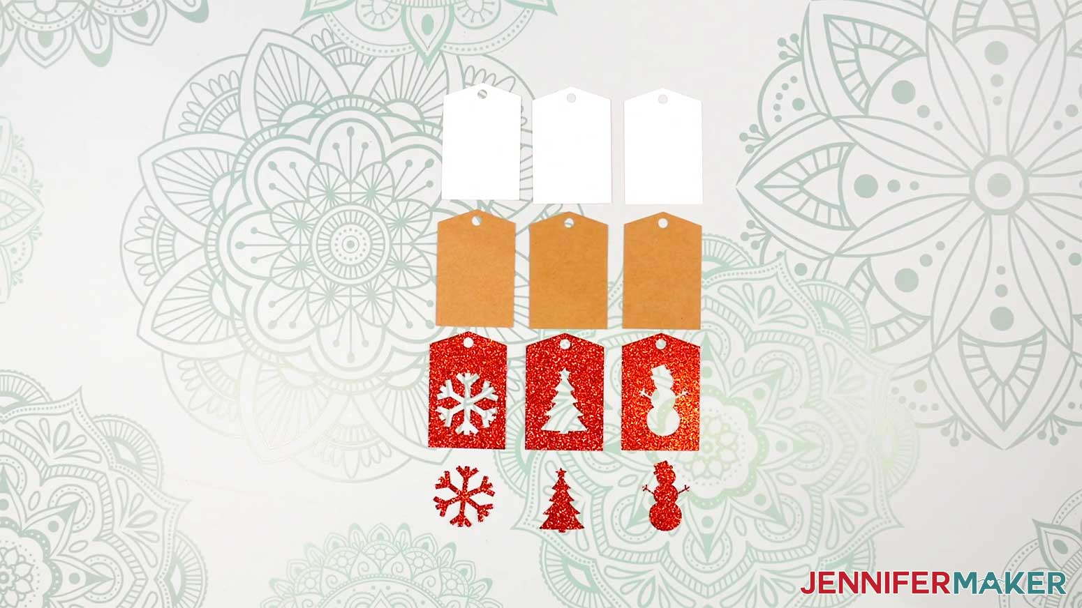 Cut out gift tag pieces laid out on the work surface in the Cricut Gift Wrapping Ideas project.
