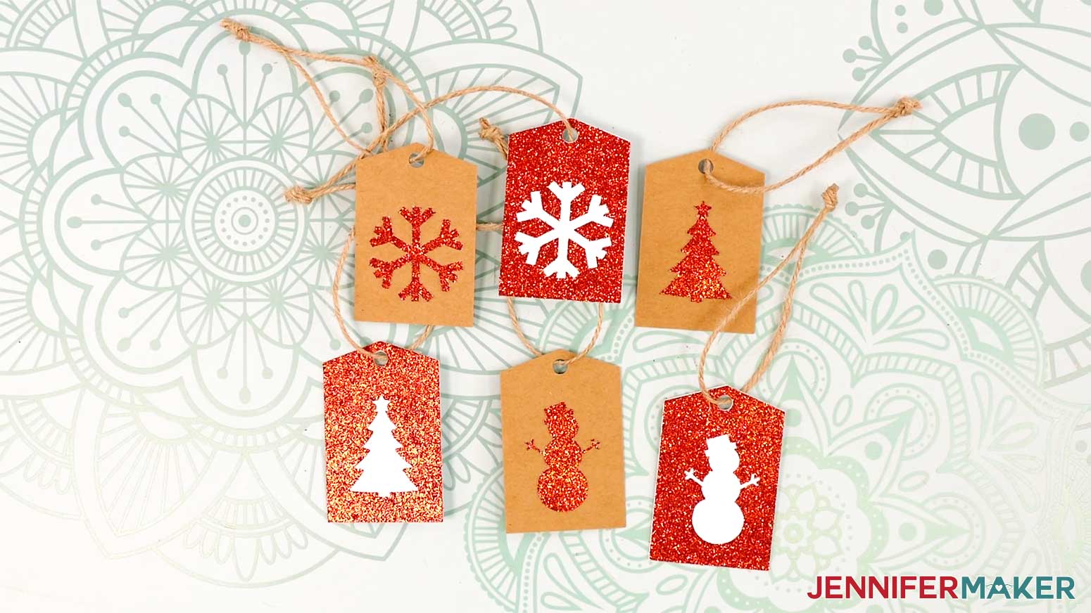 Six finished cutout gift tags laid on a work surface, from the Cricut Gift Wrapping Ideas project.