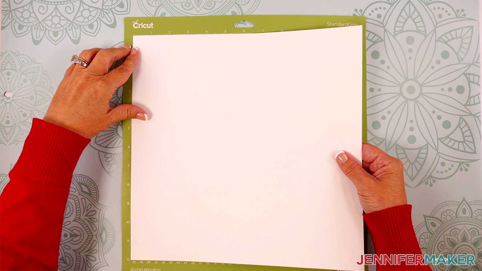 Adhere your cardstock to a green StandardGrip machine mat for the Reindeer Gift Bags in the Cricut Gift Wrapping Ideas project.