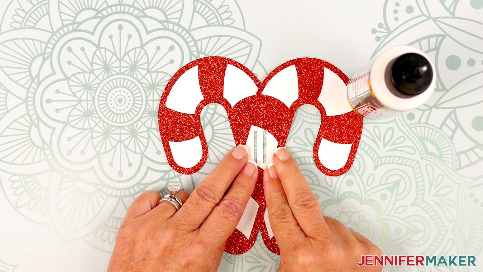 Apply glue to the bottom candy cane where the two pieces overlap and press until the glue sets.