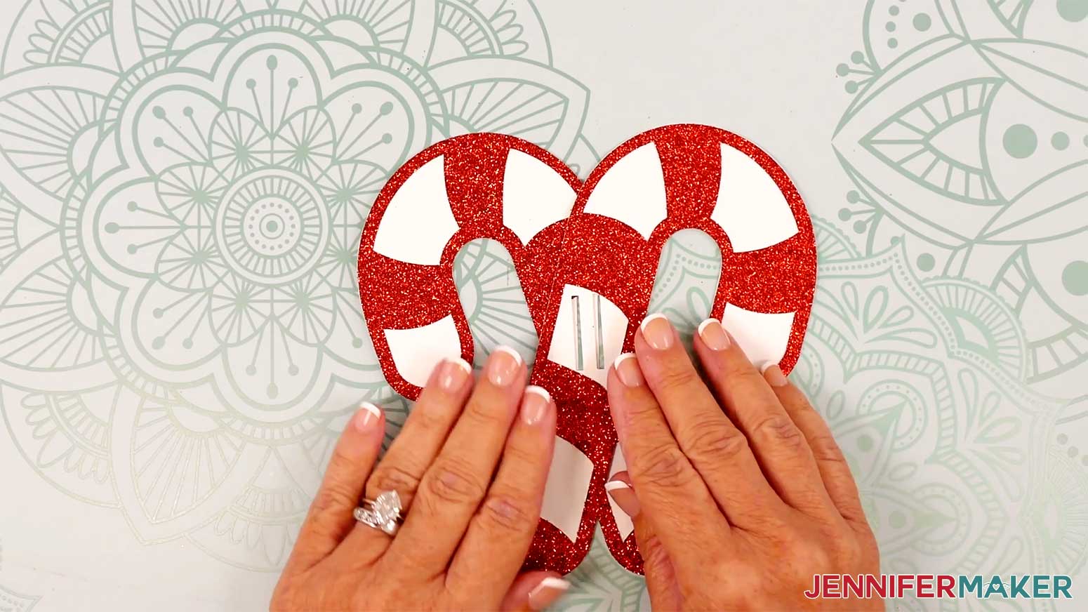Cross the candy canes, one on top of the other, and align their slits.