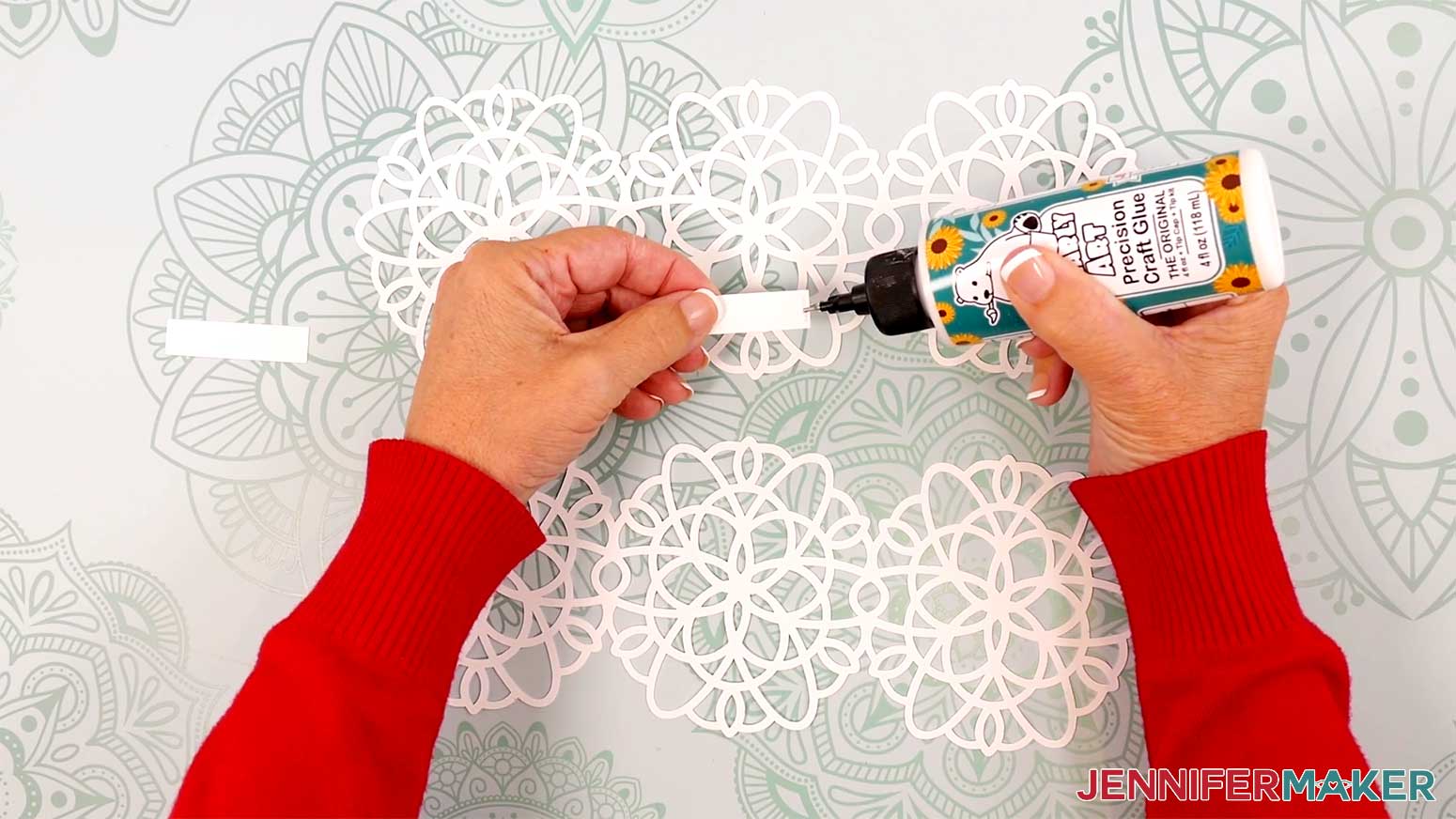 Apply a small amount of craft glue to the end of one rectangular strip.