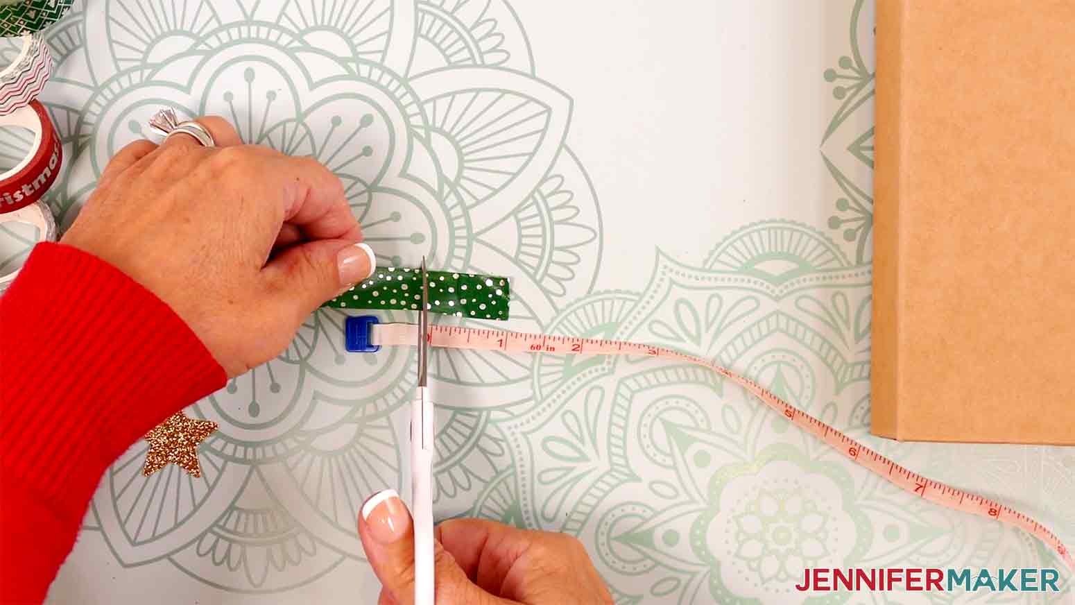 Use scissors to cut a piece of washi tape about 1-inch long for the Washi Tape decoration in the Cricut Gift Wrapping Ideas project.