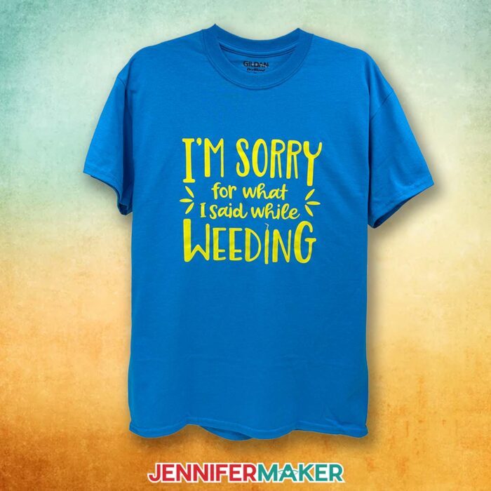 A blue T-shirt with a yellow vinyl decal says "I'm Sorry What I Said When I Was Weeding." Learn how to make T-shirts like these in my Cricut Iron-On Vinyl Tutorial