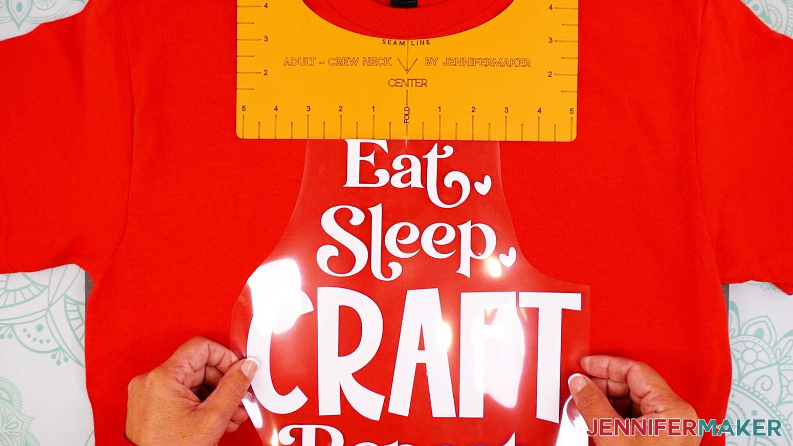 Position the Cricut Iron On Vinyl design in the center of the shirt and at the bottom of the ruler guide.