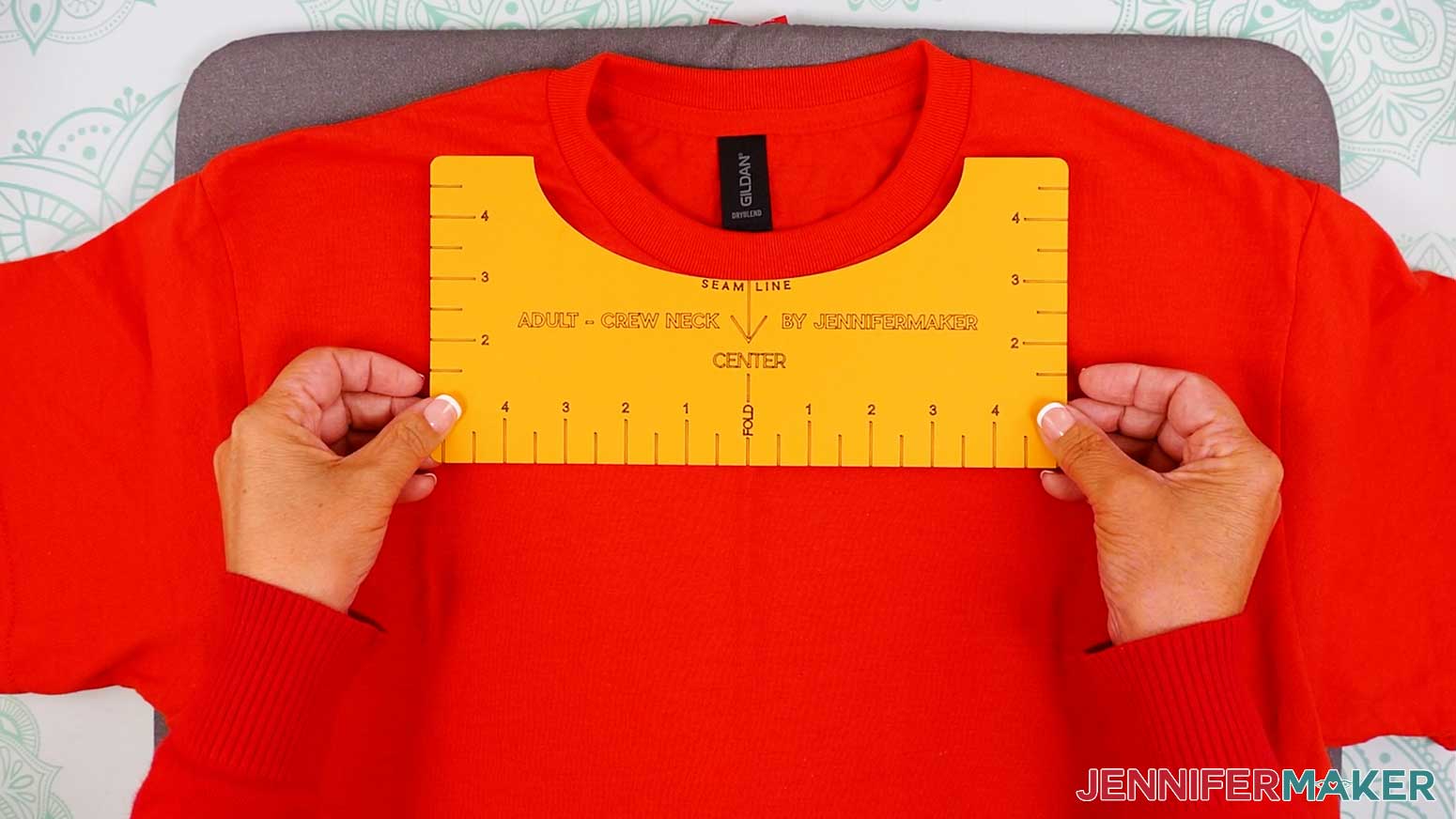 Position the t-shirt placement guide under the collar of the shirt.
