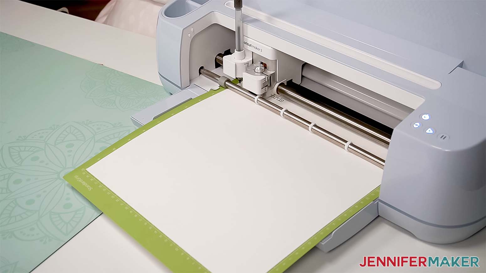 A Cricut writing label names on cardstock.