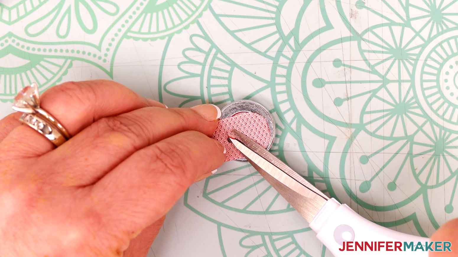 Use scissors to trim any threads that are keeping the hole attached.