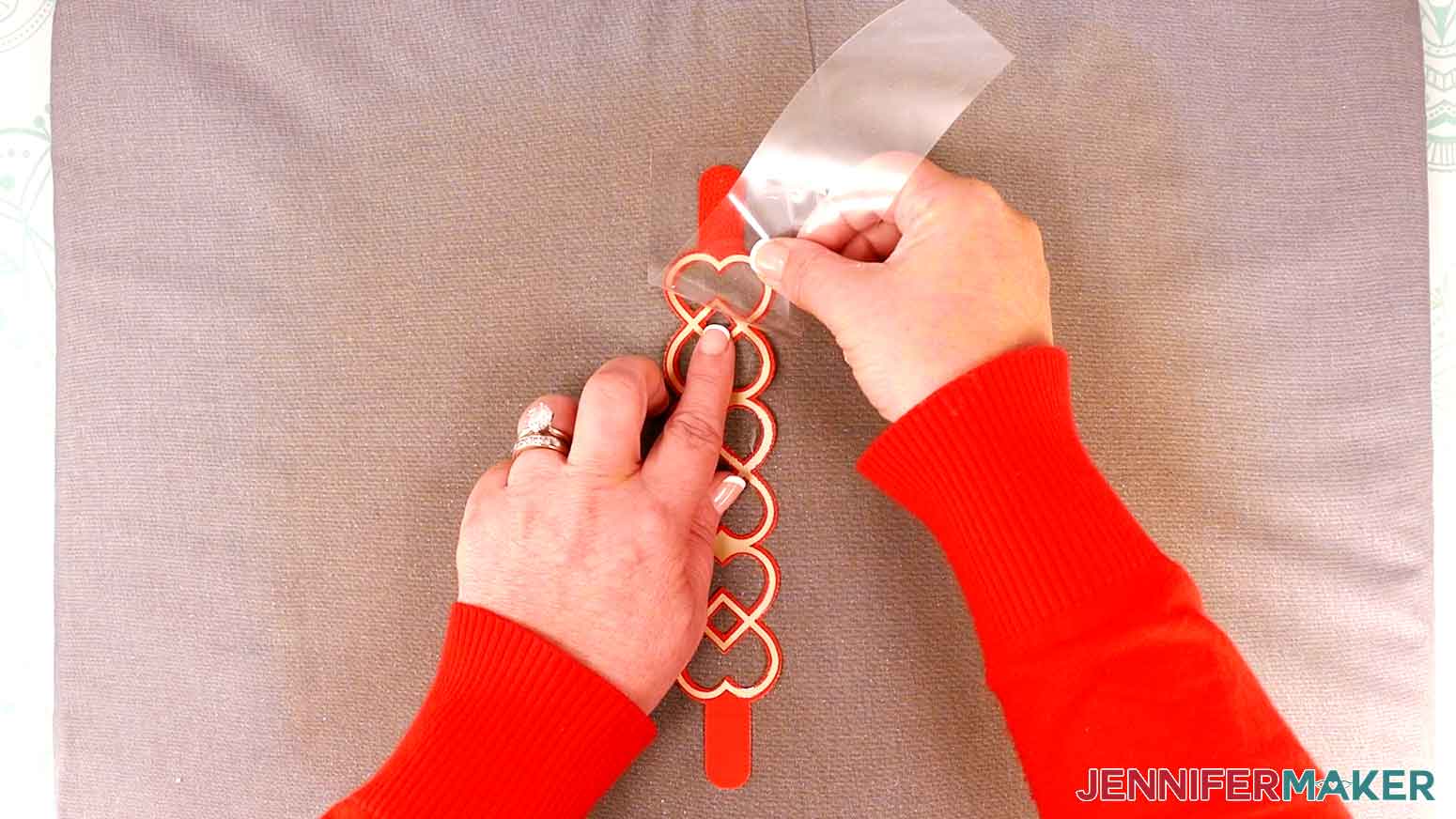 When cool, remove the iron-on vinyl carrier sheet from the bracelet.