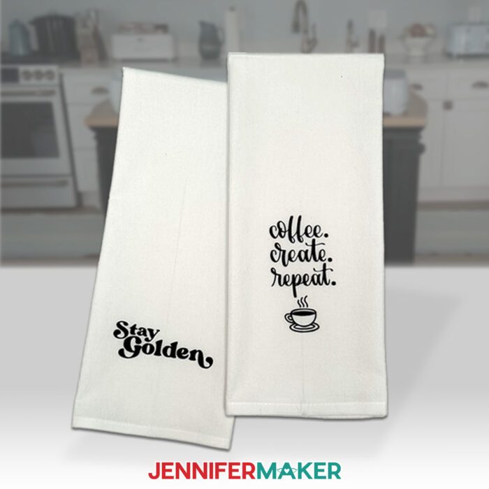 Two white tea towels decorated with black HTV sayings "stay golden" and "coffee, craft, repeat" using bonus materials included with the new Cricut Maker 4 & Cricut Explore 4!