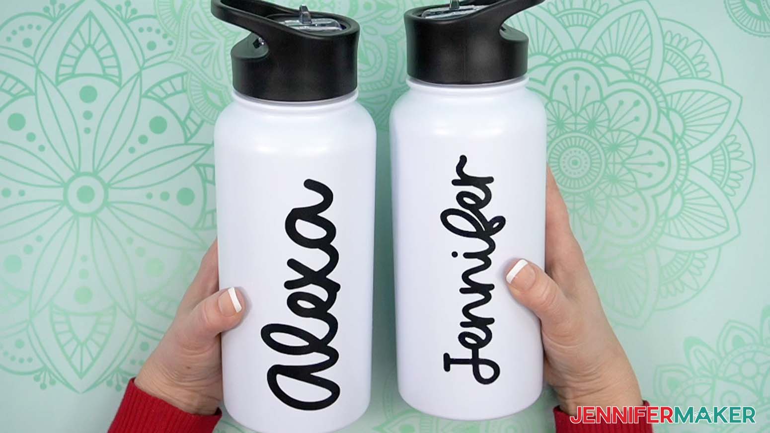 Two finished water bottles with black adhesive vinyl applied to the sides. One says "Alexa" and the other says "Jennifer."