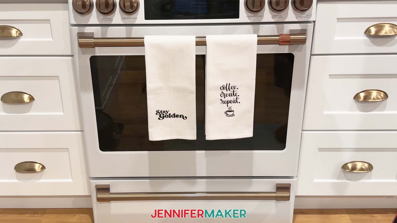 Tea towels hanging on oven.
