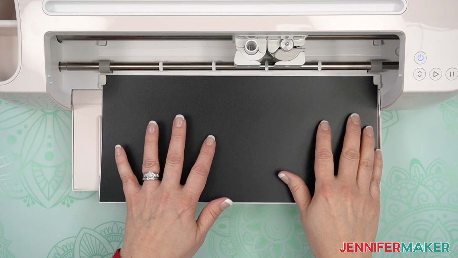 Load the test material into the Cricut Maker 4, making sure it goes under the left and right guides.