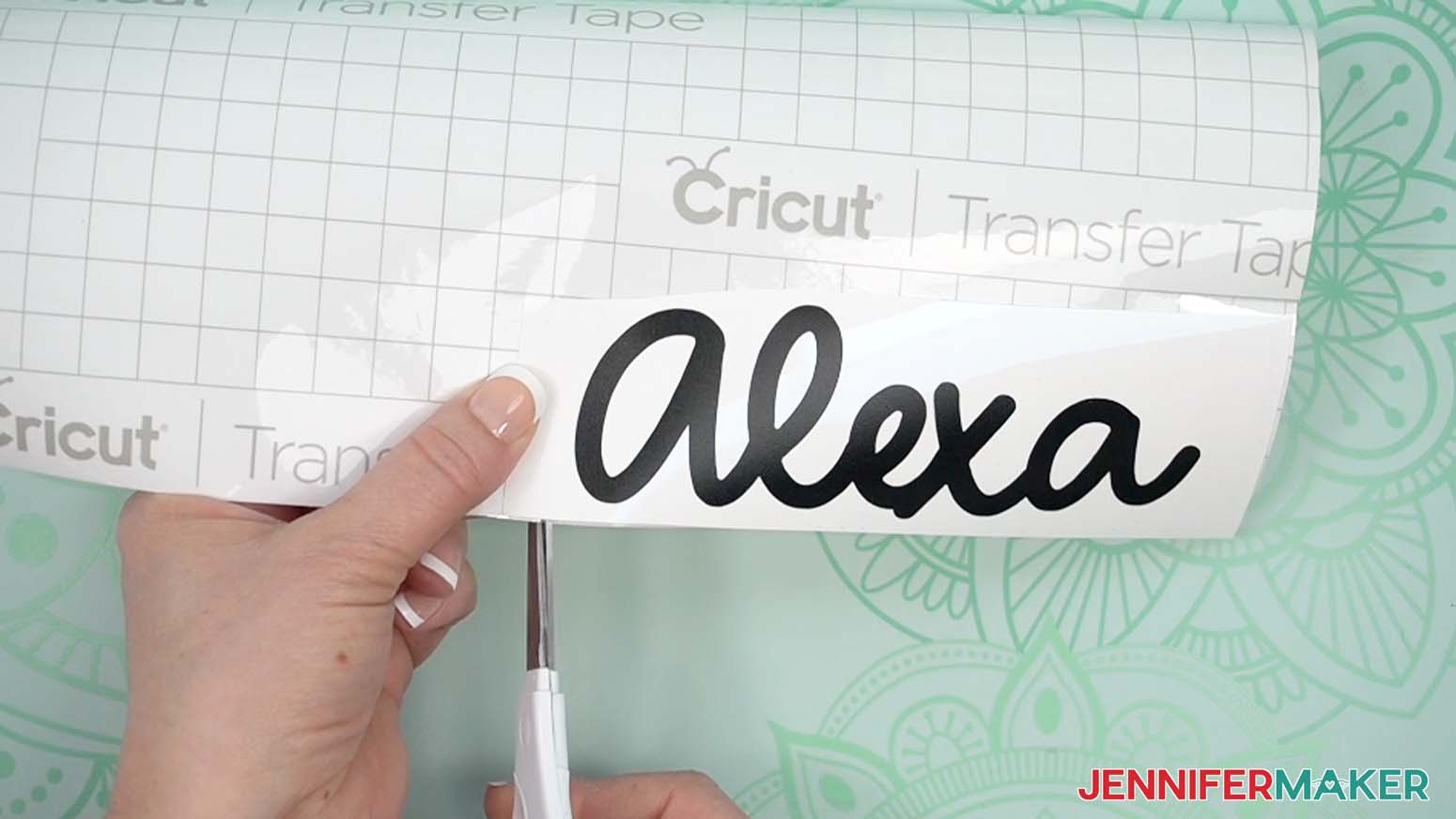 Cut the Cricut transfer tape with scissors to match the size of your adhesive vinyl design.