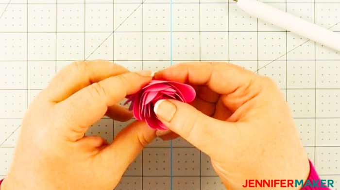 Allow the rolled Cricut paper flower to relax a little between your fingers