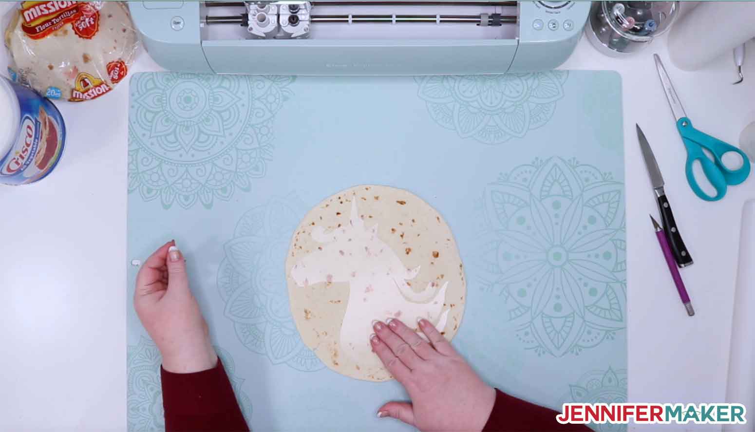 A tortilla with a unicorn stencil cut by a Cricut on top of it!