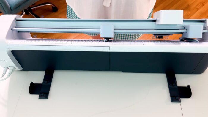 Cricut Venture roll supports behind the machine
