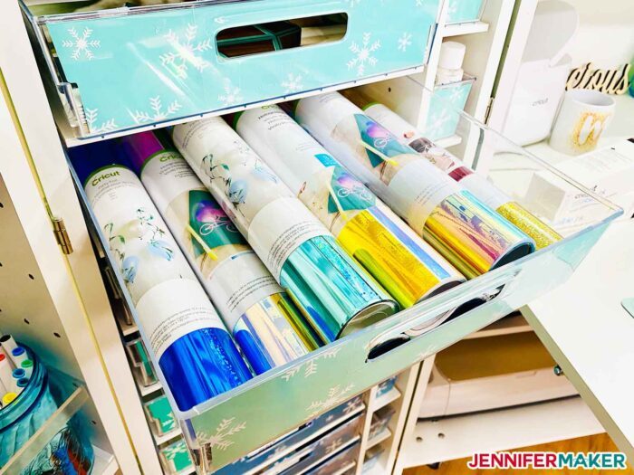 Rolls of Cricut holographic vinyl organized in a DreamBox drawer