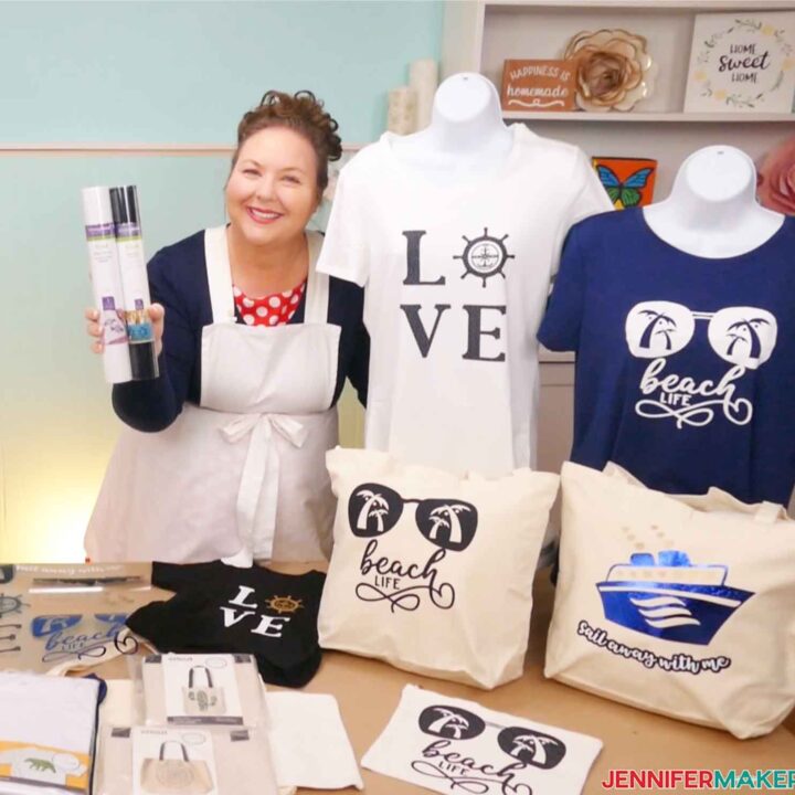 Jennifer Maker holds two rolls of Cricut vinyls beside several HTV shirts, totebags, and a makeup bag.