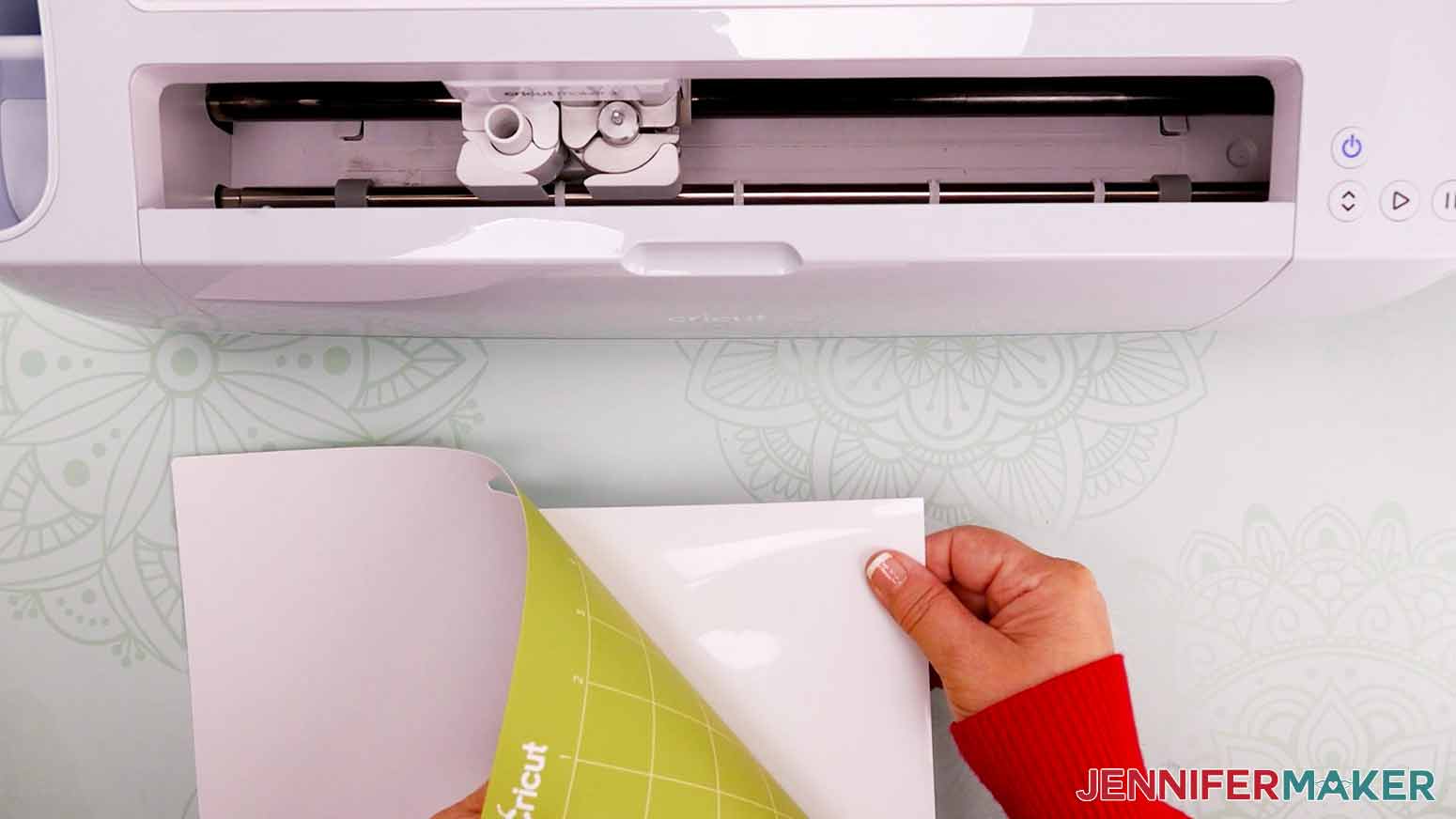 Flip the cutting mat over and peel it away from the vinyl to prevent curling.