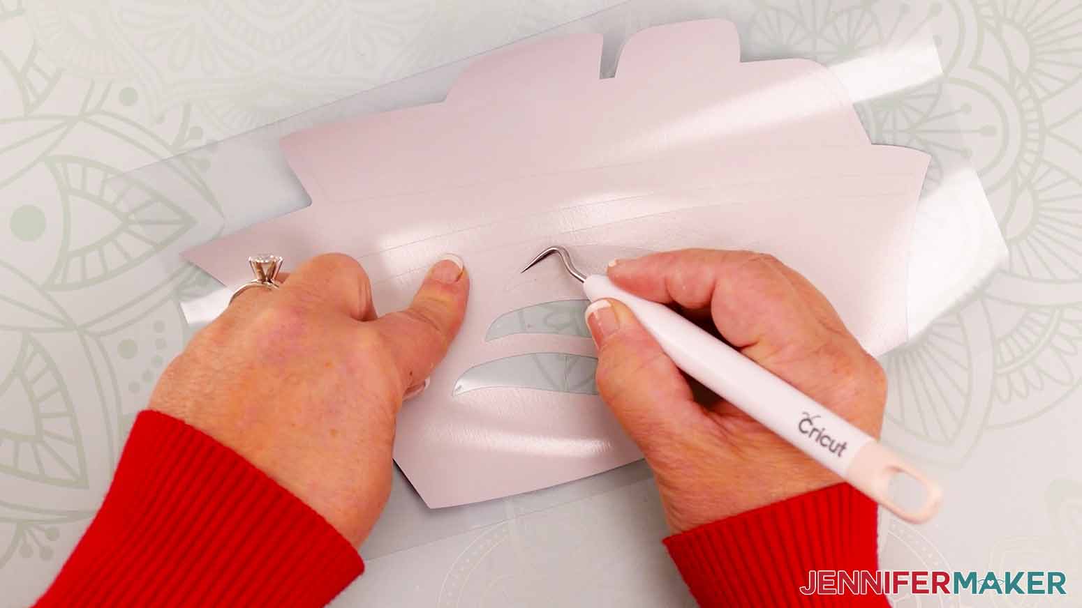 Use weeding tool to remove extra vinyl from design.