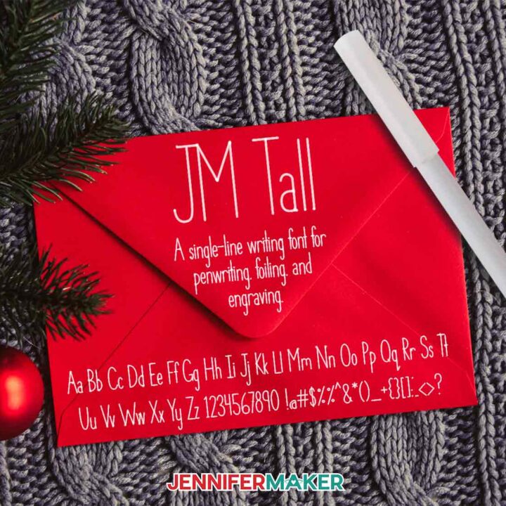 JM Tall penwriting font in Cricut Opaque pen on a red envelope