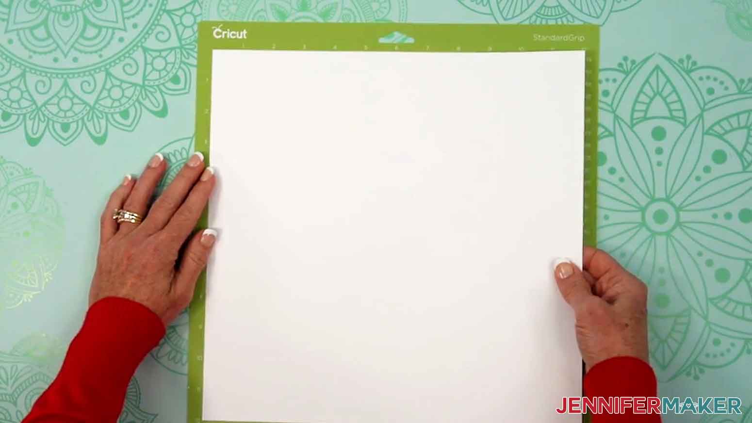 Place a sheet of 12"x12" white cardstock on a green StadardGrip machine mat.