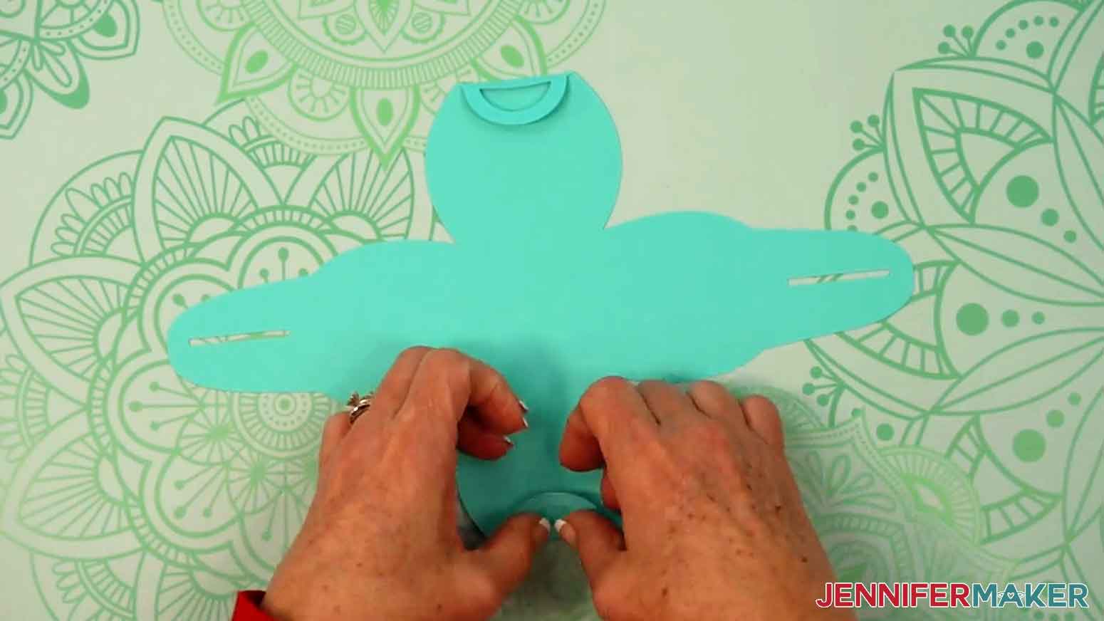 Fold the handle tabs along the score lines to crease them.