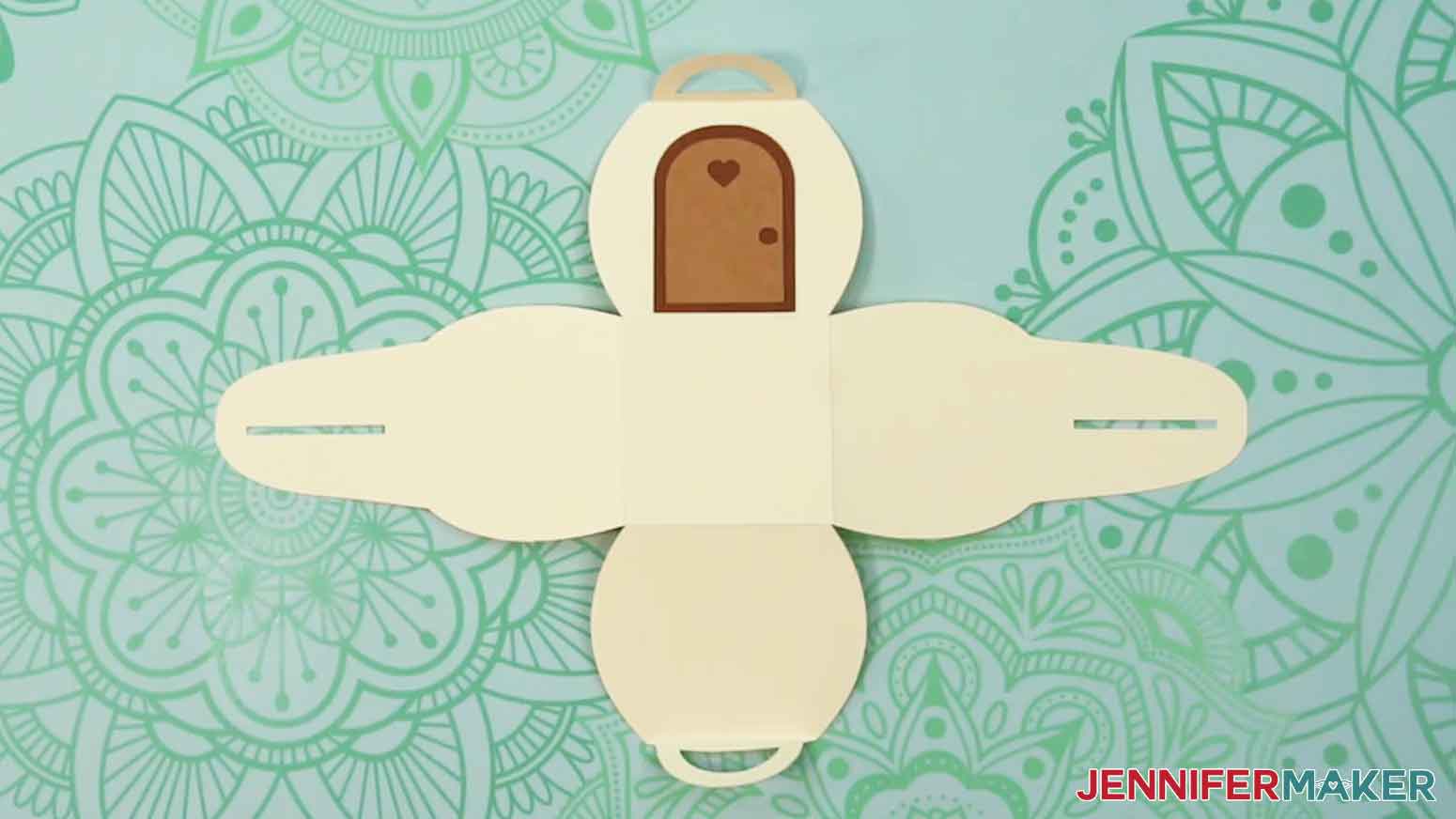 Adhere the light brown cutout door piece on top of the darker brown shape.