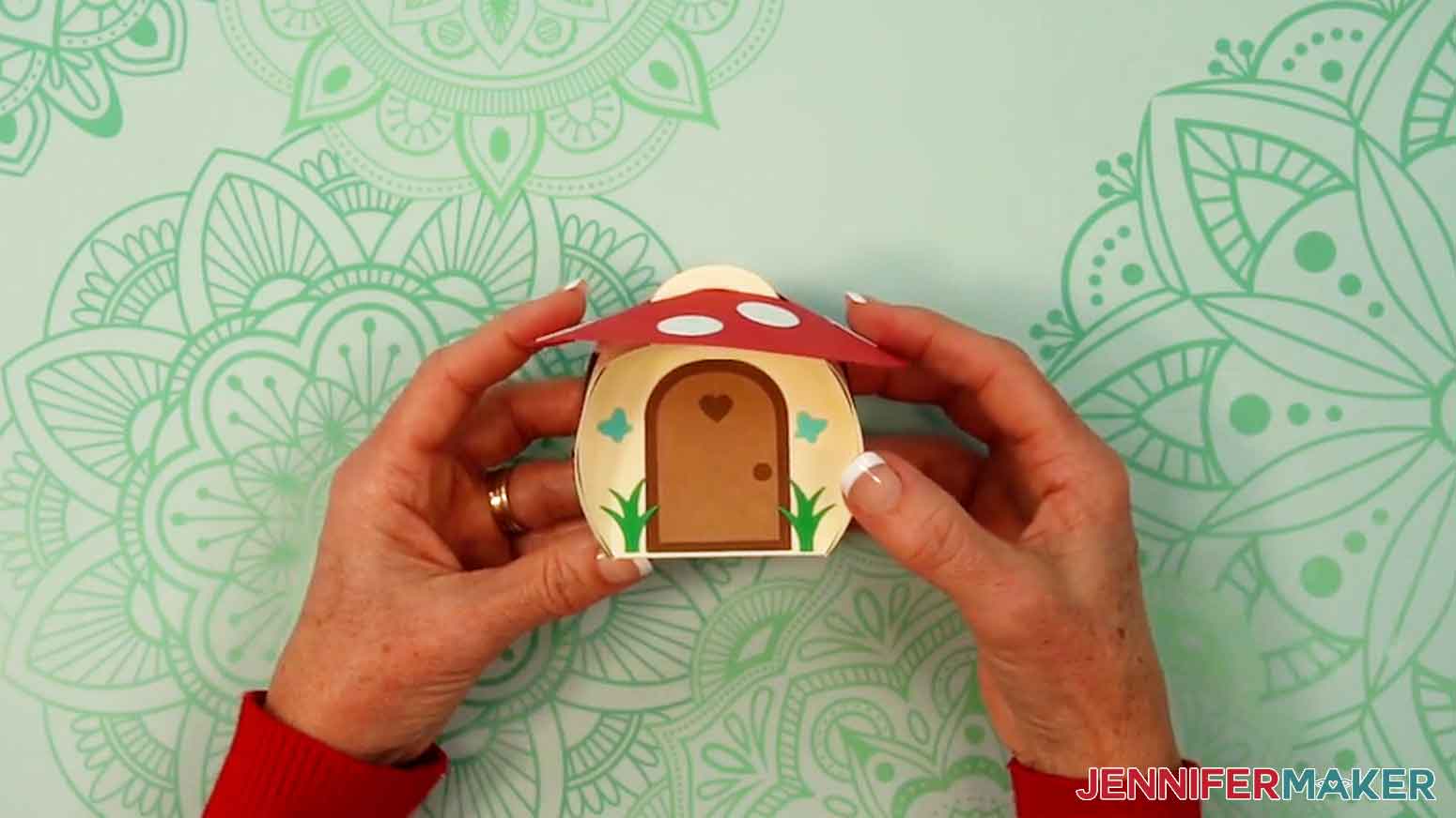 Place the red roof on the mushroom house to complete the design.