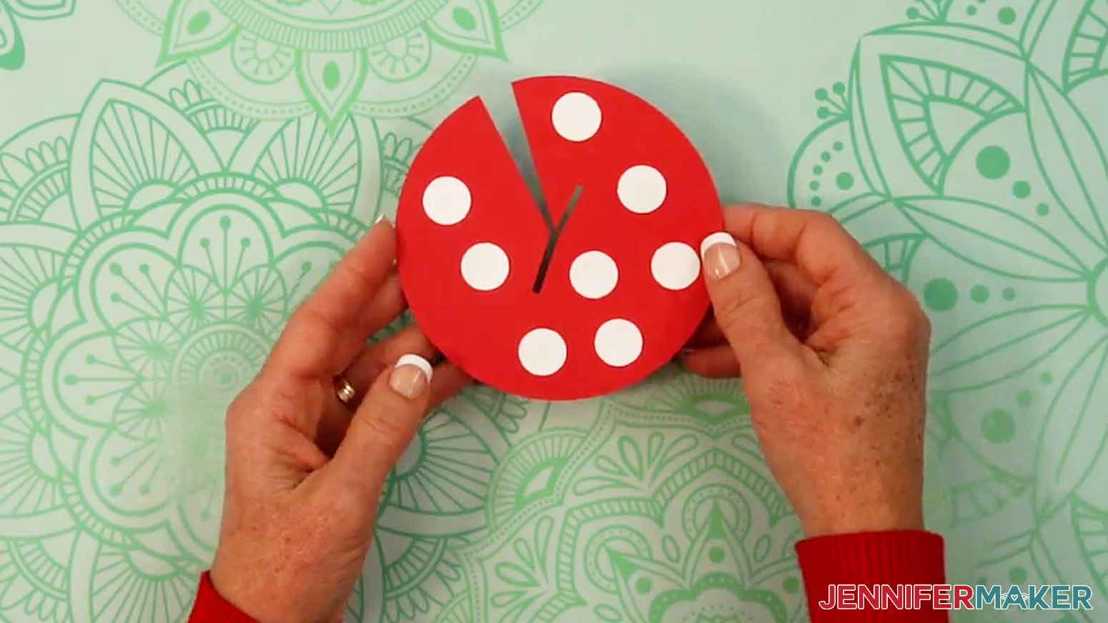 Glue the white circles on the red mushroom roof piece.