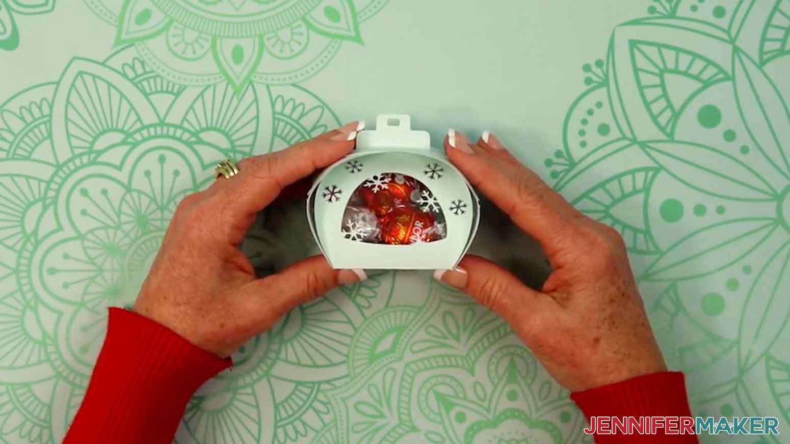 Insert a treat and close the other side of the snowflake curvy keepsake box.