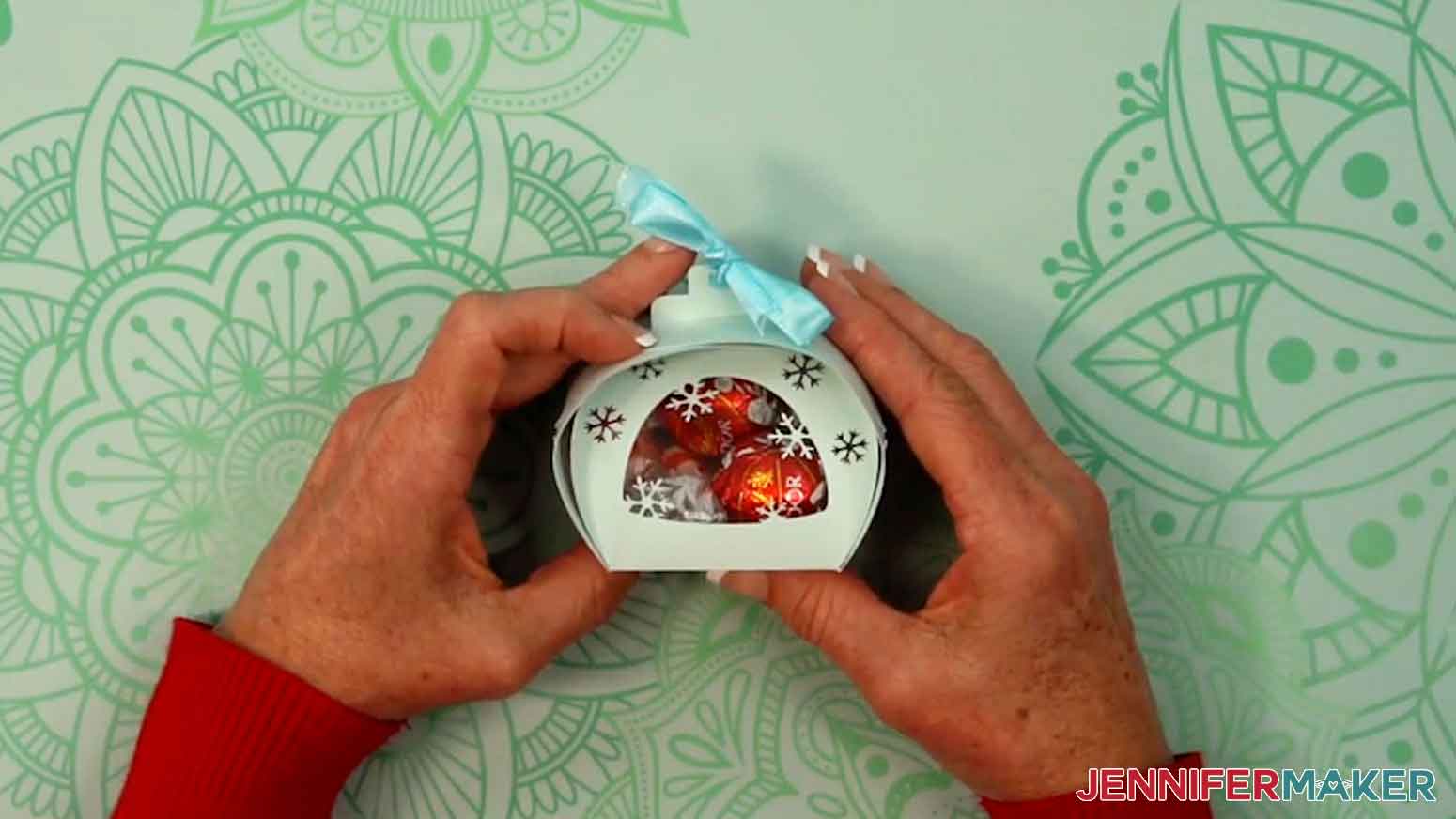 Tie the ribbon in a bow to complete the snowflake curvy keepsake box.