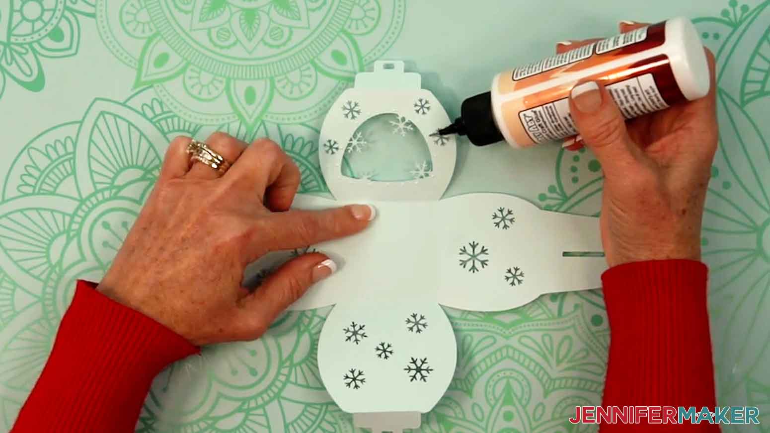 Place small dots of craft glue around the window cutout.