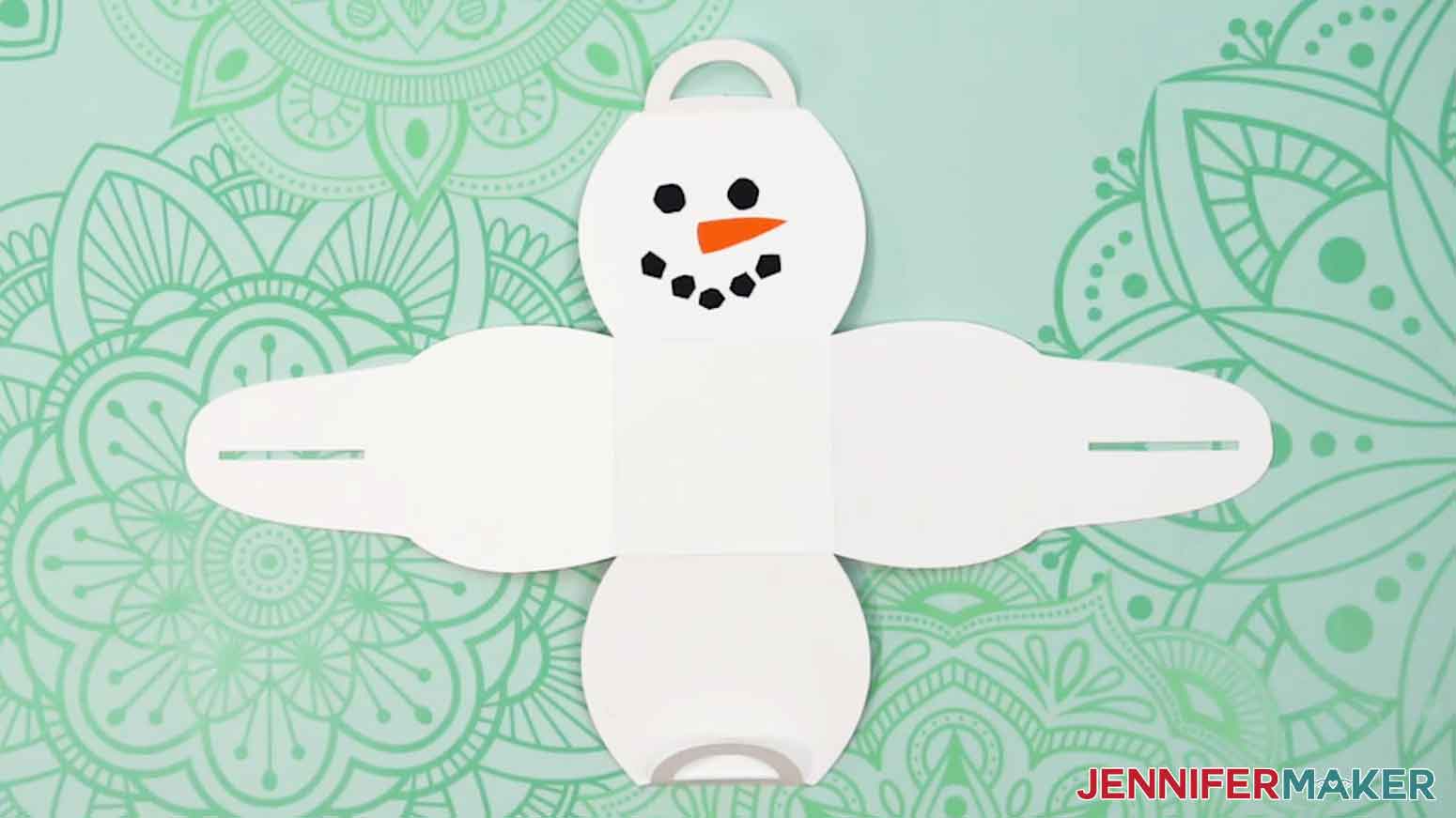 Attach the rest of the black cardstock to complete the snowman smile.