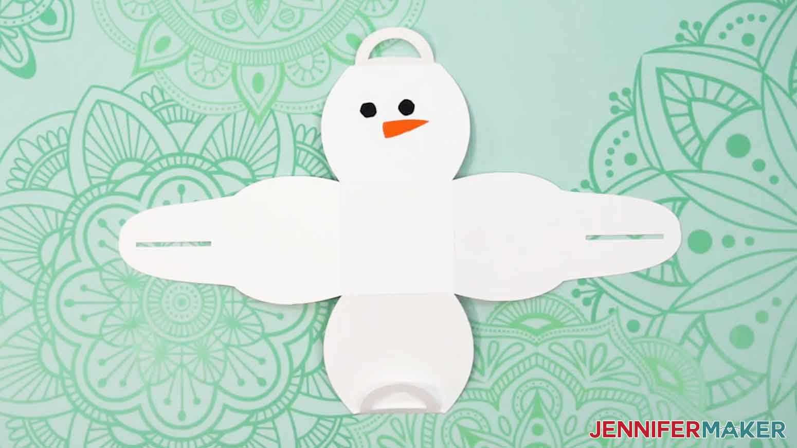 Add the second eye and the nose to the snowman box.