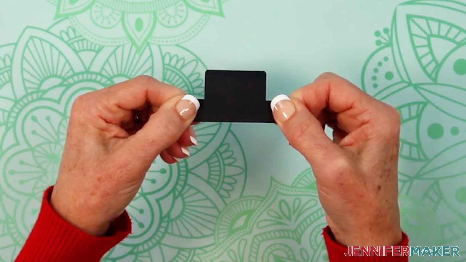 Fold the hat in half and press it together to glue the edges.
