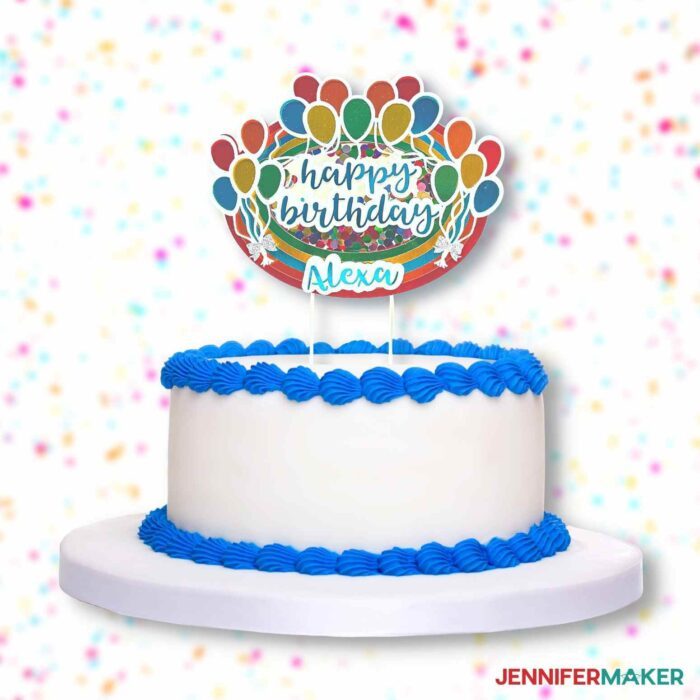 Custom "happy birthday" cake topper on a white cake with blue icing