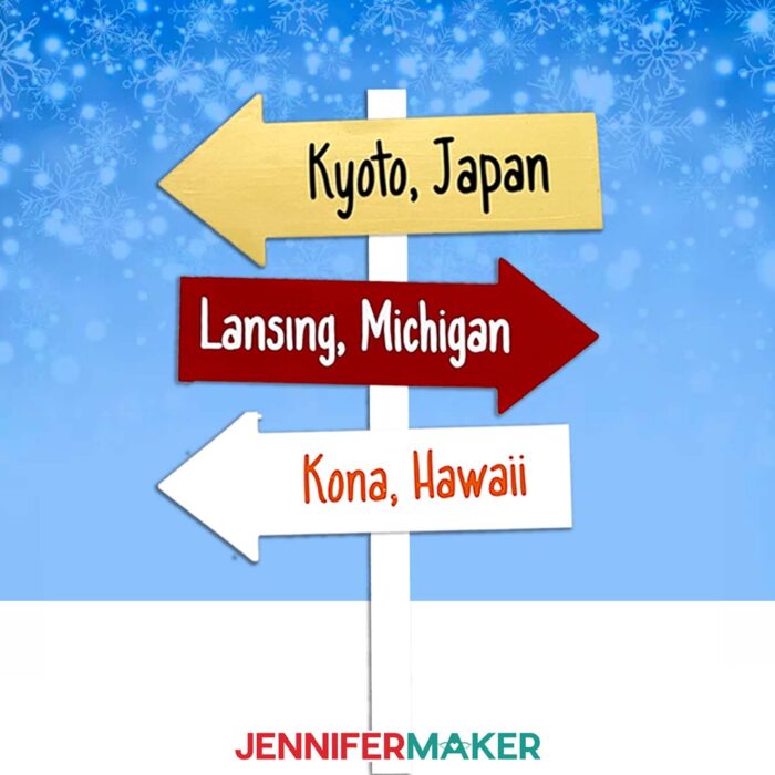 Make a custom family sign post with JenniferMaker's tutorial! A signpost with three arrows reading "Kyoto, Japan," "Lansing, Michigan," and "Kona, Hawaii" stand against a snowy background.