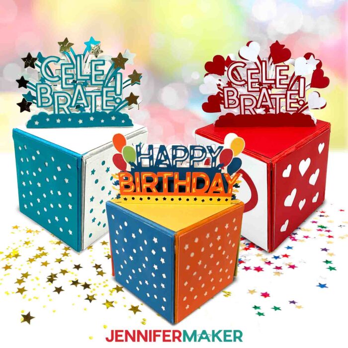 Learn How to Cut Cardboard with Cricut in JenniferMaker's tutorial. Fun, multicolored cardboard jumping boxes scattered with confetti sit on a white surface with fun birthday balloons in the background.