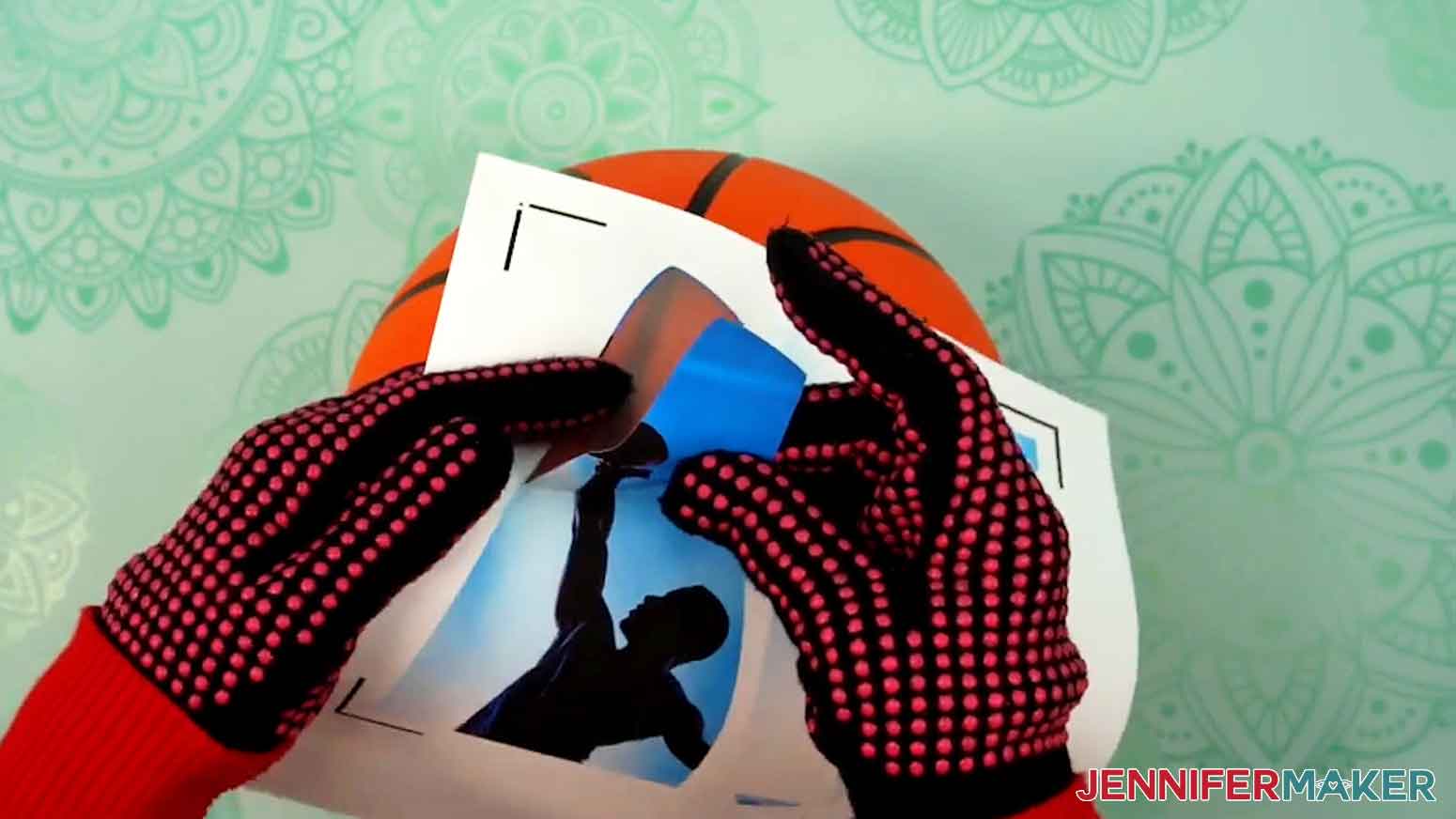 Gently peel the cut iron-on vinyl piece from the backer sheet.