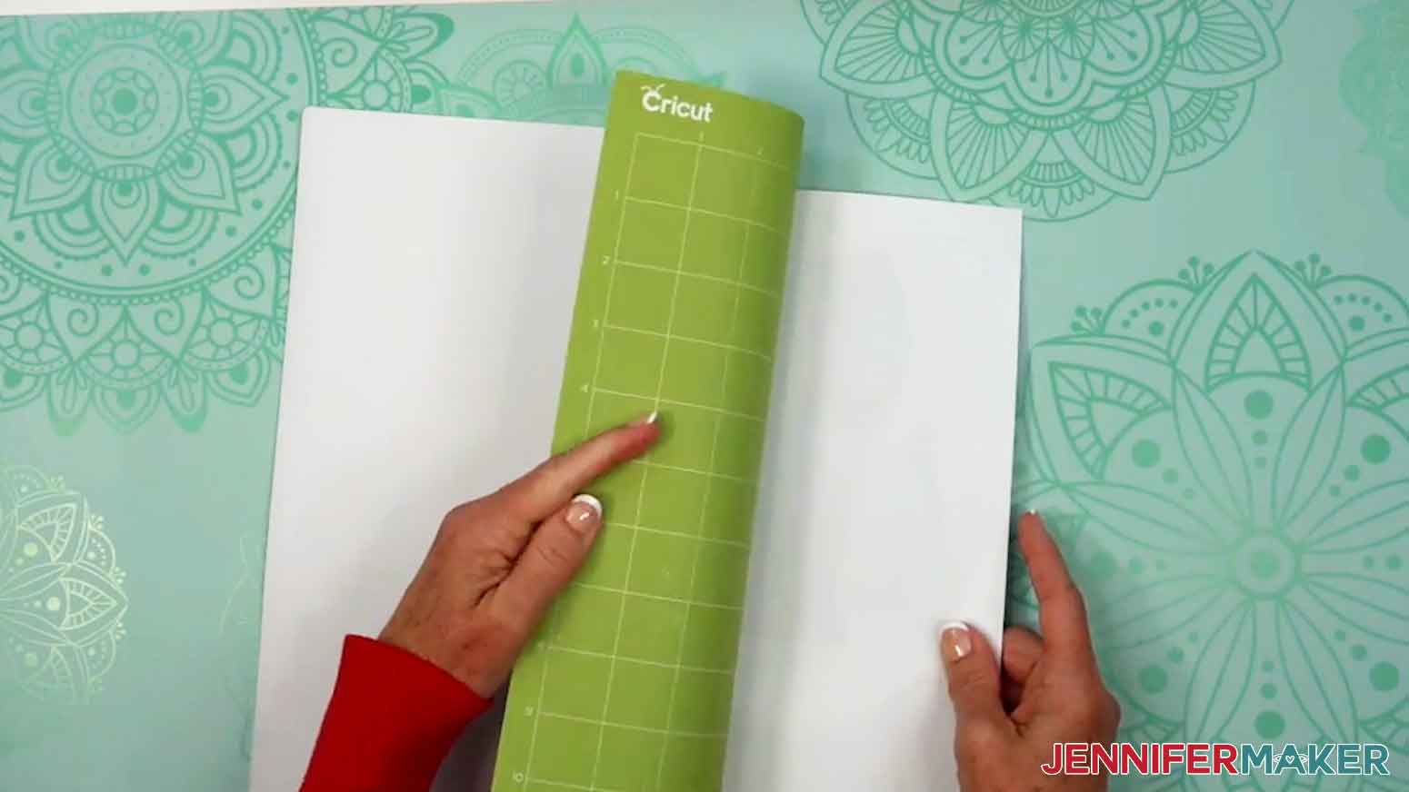 Flip over the machine mat and gently remove the iron-on vinyl from the mat.