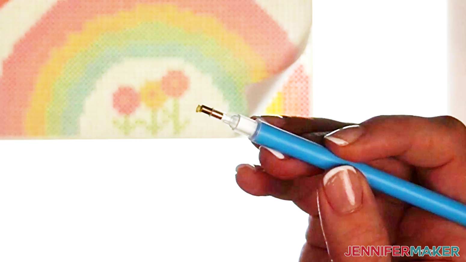 Pick up the diamond drill on the tip of the damond pen tool after the wax has been loaded into the tool.