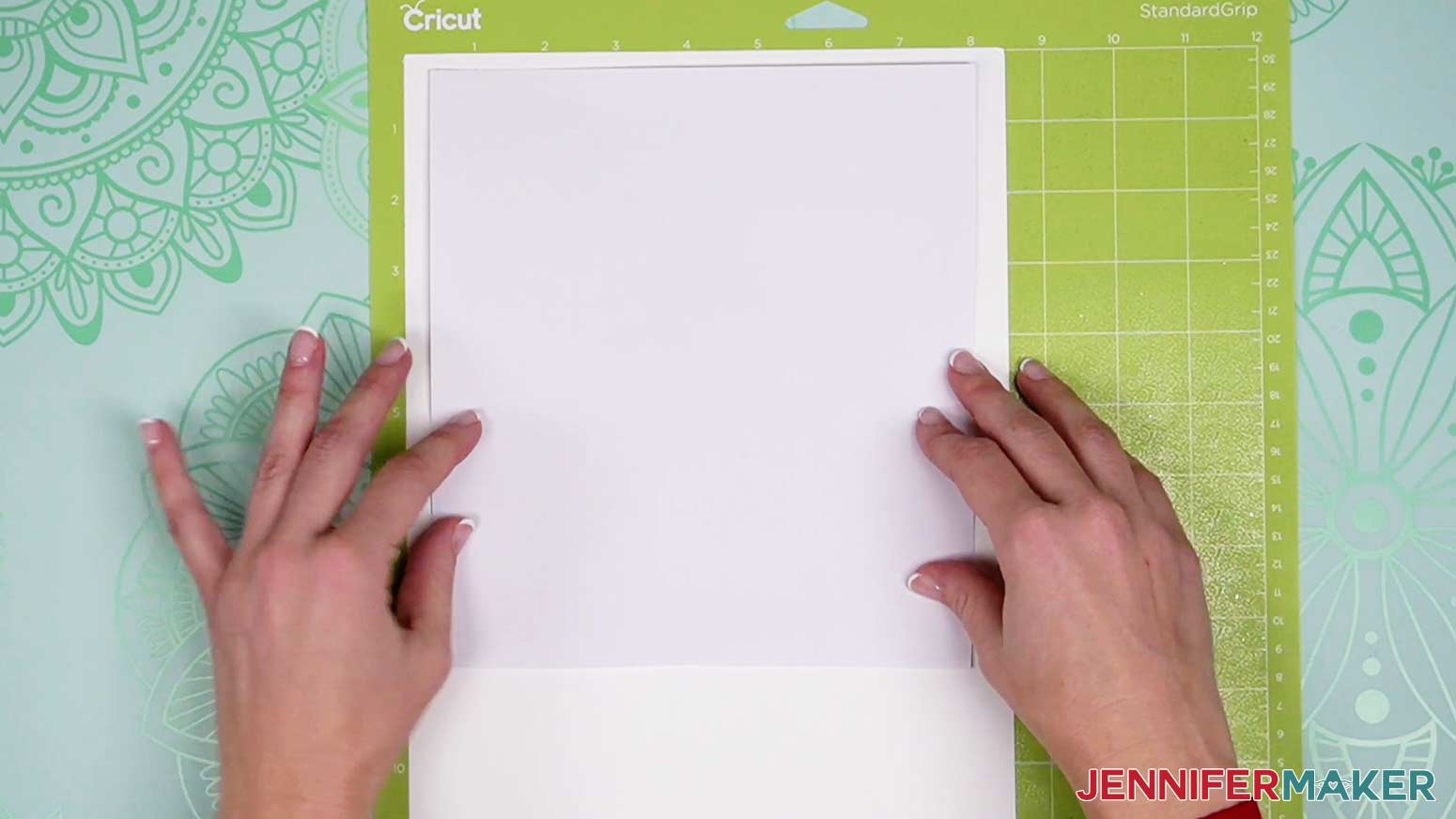 Cut a piece of adhesive paper large enough to cover the entire printed area.