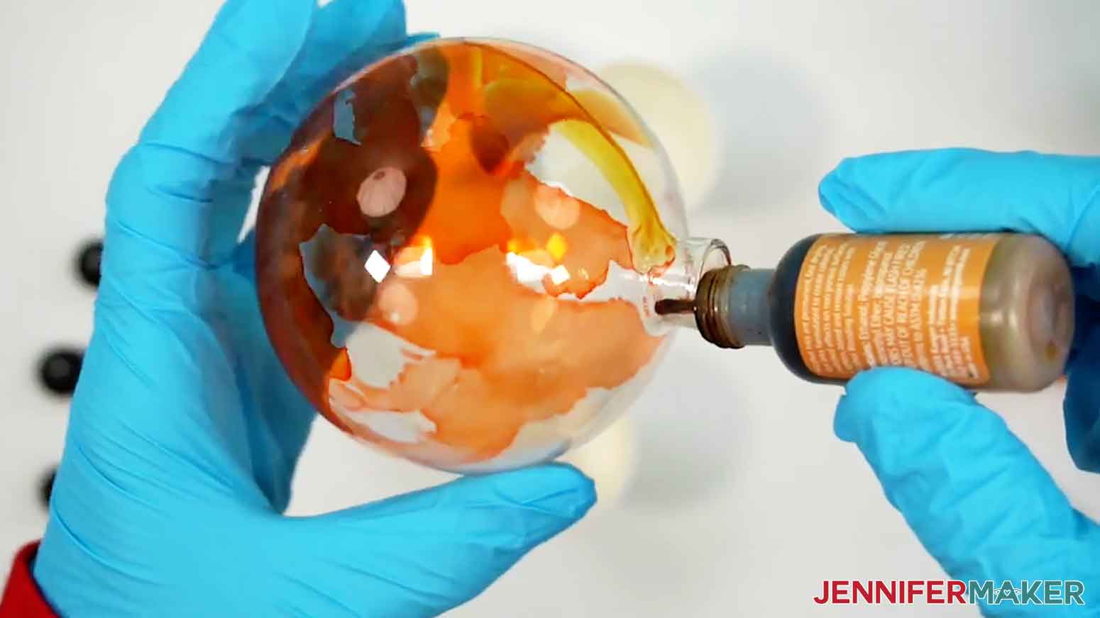 Gently drip the yellow alcohol ink into the ornament.