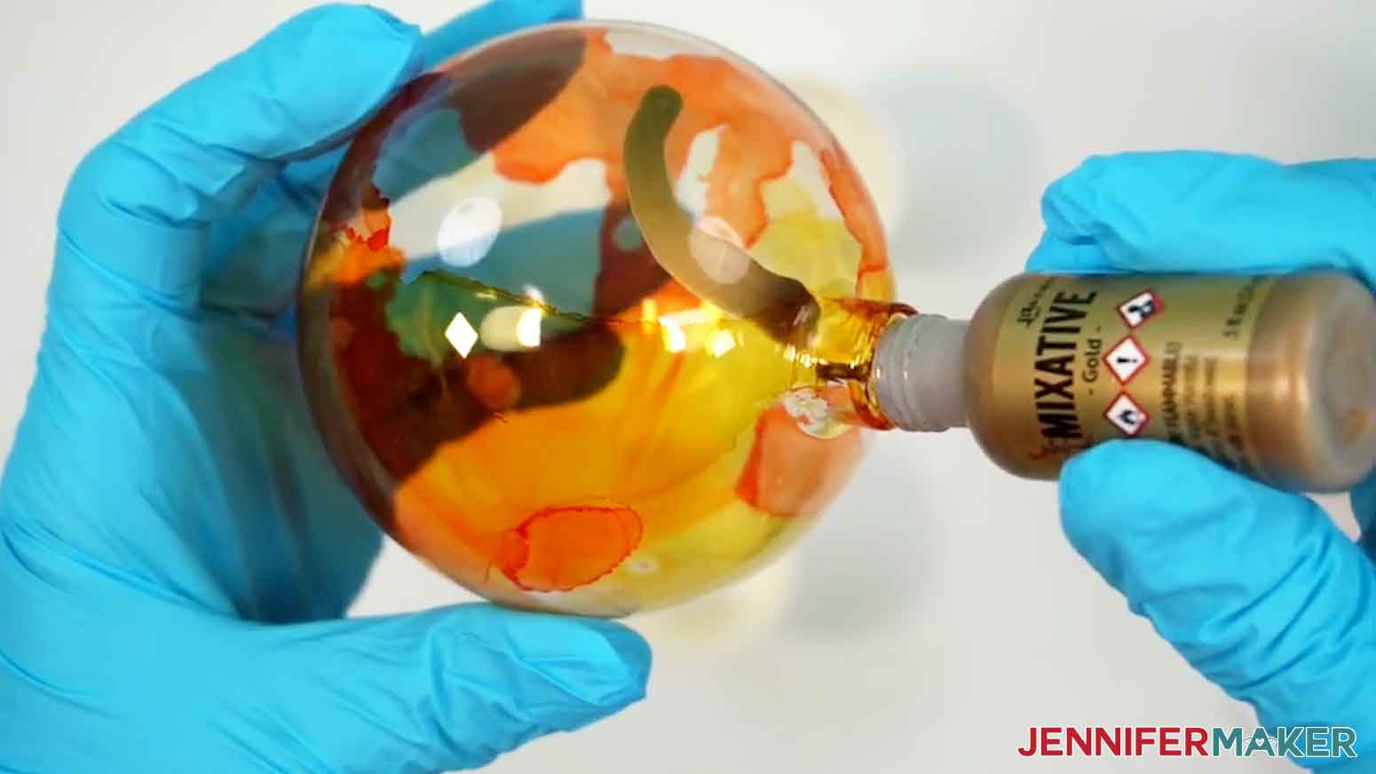 Add several drops of gold alcohol ink to the ornament.
