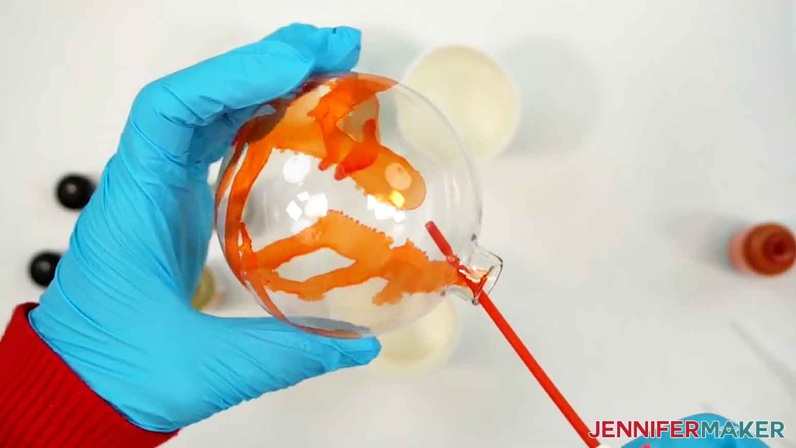 Gently squeeze the trigger on the compressed air to blow air onto the alcohol ink in short, small bursts.